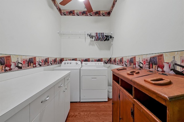 laundry area featuring separate washer and dryer, ceiling fan, and light hardwood / wood-style flooring