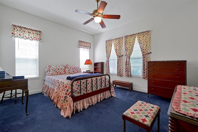 bedroom featuring ceiling fan and dark colored carpet