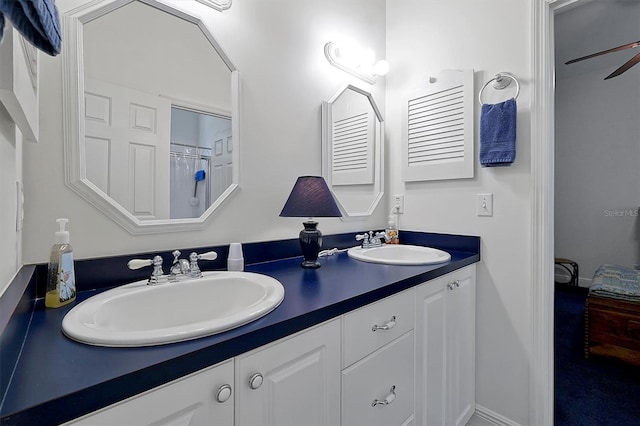 bathroom with dual vanity and ceiling fan