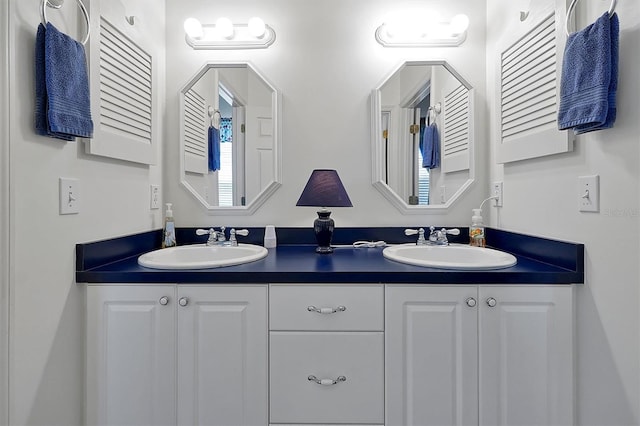 bathroom featuring double vanity