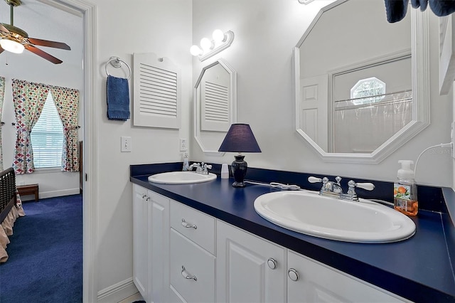 bathroom with ceiling fan and double sink vanity