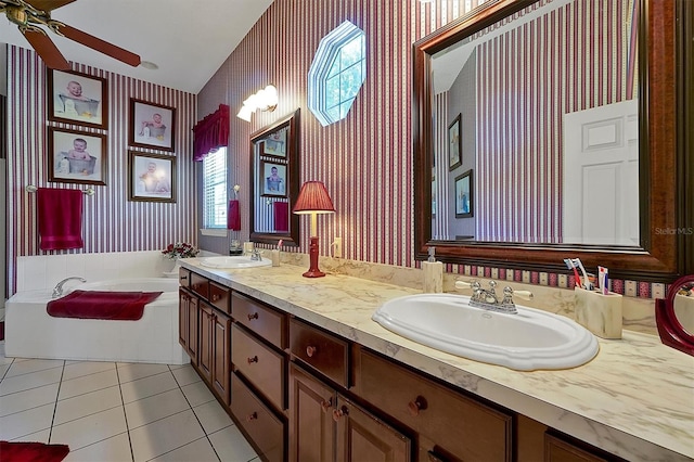 bathroom featuring dual vanity, a bathtub, ceiling fan, and tile flooring