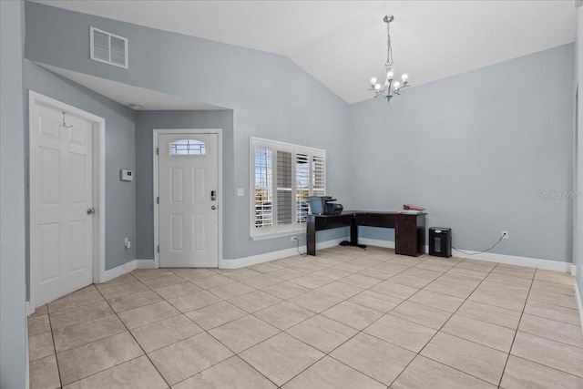 tiled entrance foyer with vaulted ceiling and an inviting chandelier