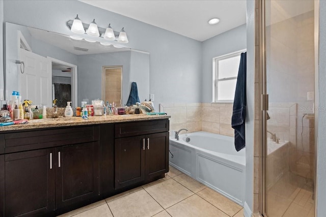 bathroom featuring separate shower and tub, tile floors, and vanity