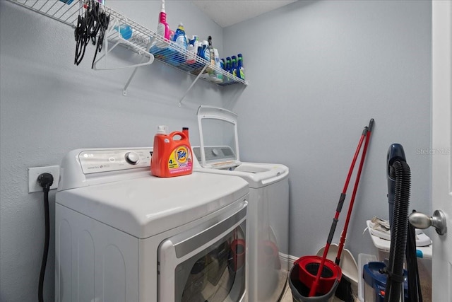 laundry area featuring separate washer and dryer and electric dryer hookup