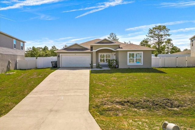 view of front facade featuring a garage and a front lawn