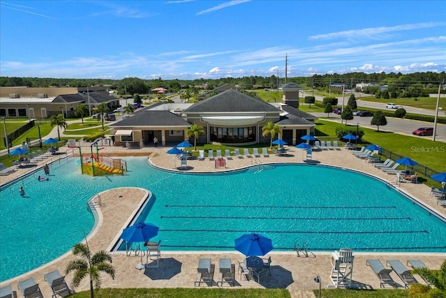 view of swimming pool featuring a patio area