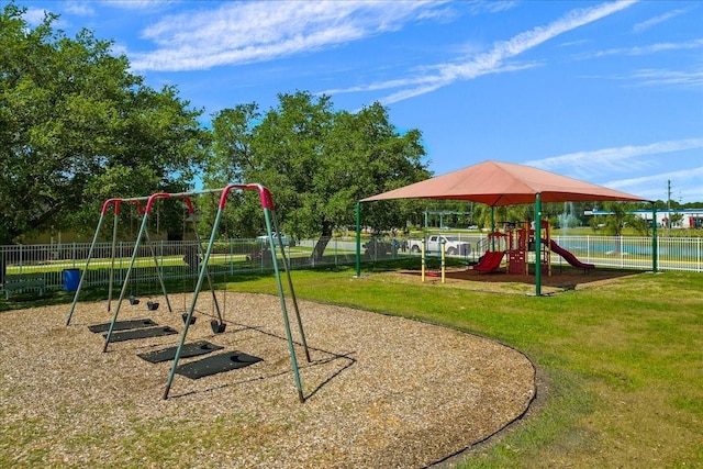 view of playground with a lawn