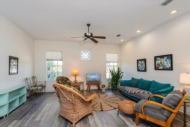 living room with ceiling fan, dark hardwood / wood-style floors, and a healthy amount of sunlight