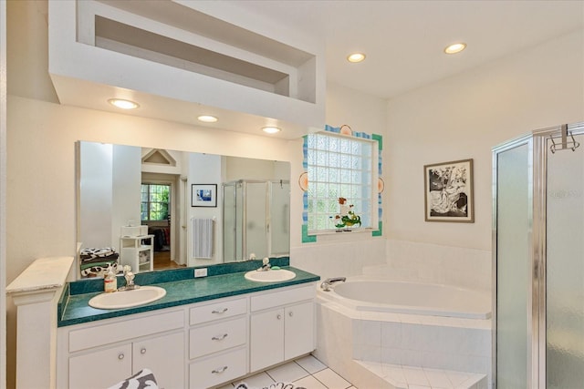 bathroom featuring tile patterned floors, plus walk in shower, and vanity