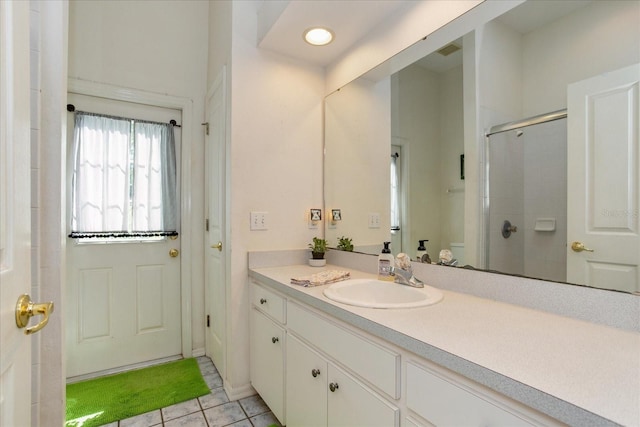 bathroom with vanity, tile patterned floors, and walk in shower