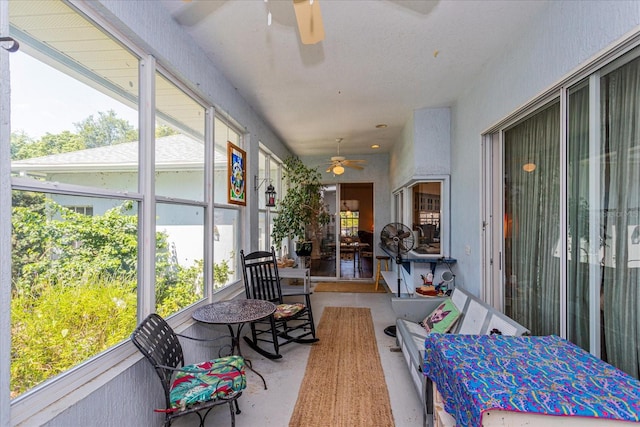 sunroom / solarium with ceiling fan