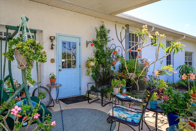 entrance to property with a patio area