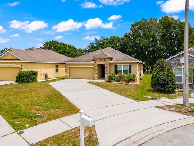 ranch-style home with a front yard and a garage