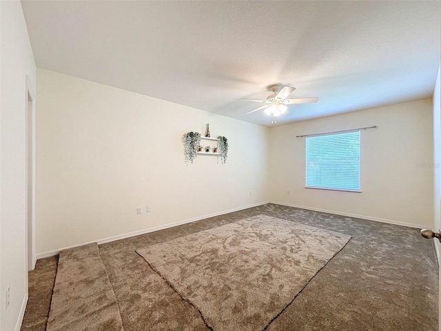 unfurnished room featuring a textured ceiling, ceiling fan, and carpet flooring