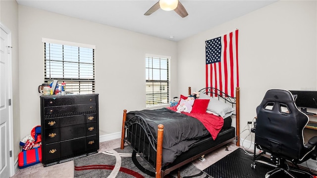 bedroom with carpet, multiple windows, and ceiling fan