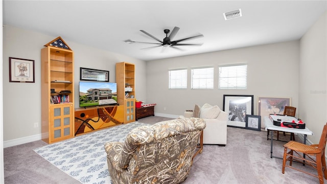 living room featuring carpet flooring and ceiling fan