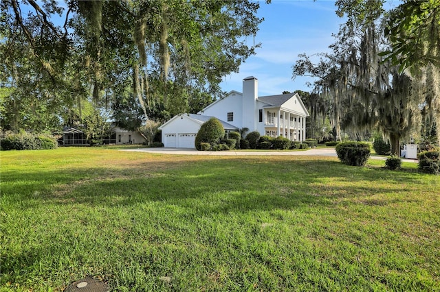 view of yard with a garage