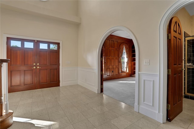 view of carpeted entrance foyer