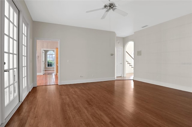 spare room with ceiling fan and dark wood-type flooring