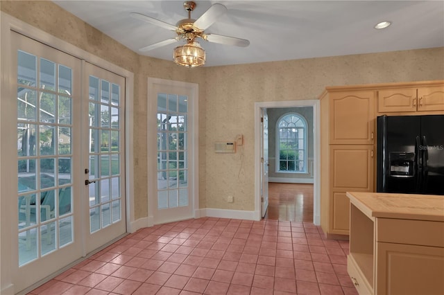 doorway with ceiling fan, french doors, and light tile patterned flooring