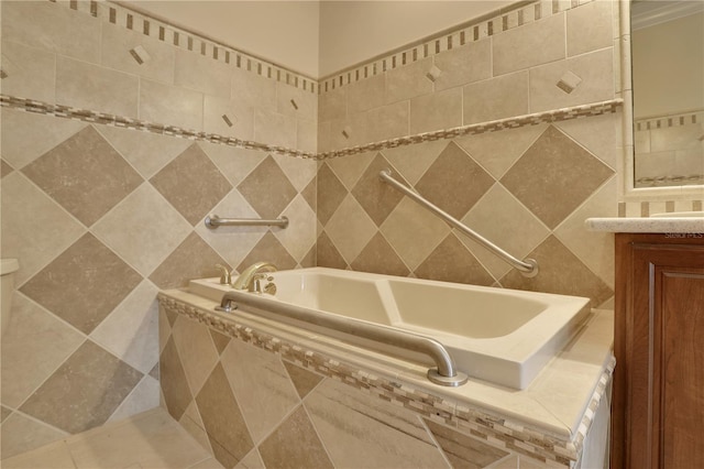 bathroom featuring vanity, tile walls, and a relaxing tiled tub