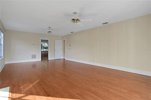 unfurnished room with ceiling fan and wood-type flooring