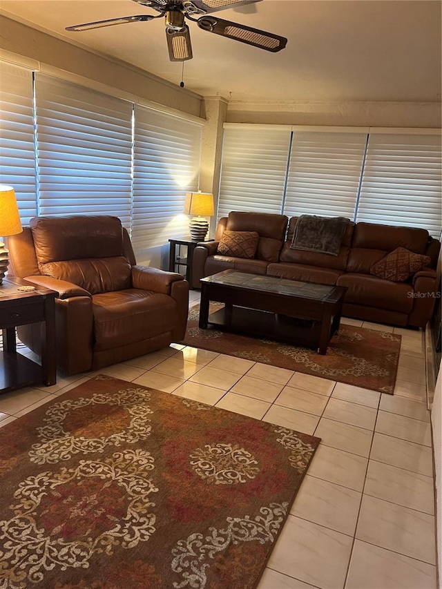 tiled living room with ceiling fan