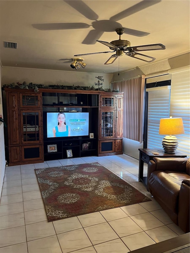 living room with ceiling fan and light tile patterned flooring