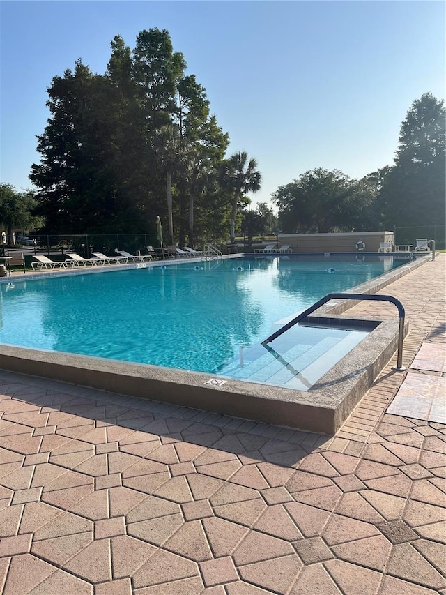 view of swimming pool featuring a patio area