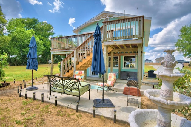 view of terrace with an outdoor living space, a deck, and central AC