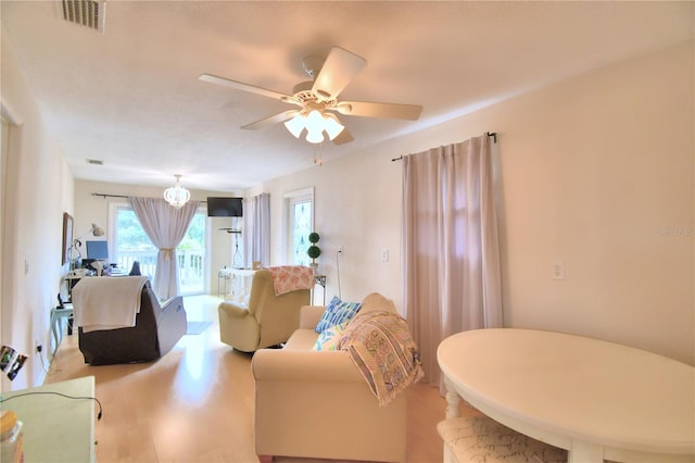 living room featuring wood-type flooring and ceiling fan