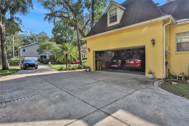 8608 Poinsettia Dr, Temple Terrace, FL 33637 - view of side of home featuring a garage