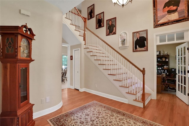 8608 Poinsettia Dr, Temple Terrace, FL 33637 - stairway featuring a high ceiling and hardwood / wood-style flooring