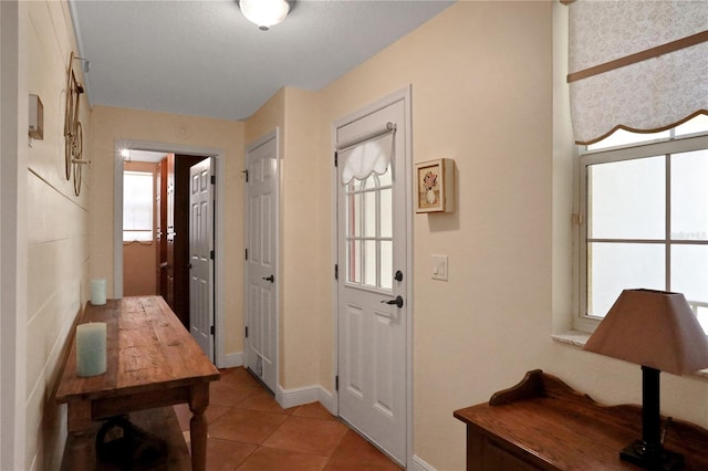 8608 Poinsettia Dr, Temple Terrace, FL 33637 - doorway to outside featuring tile floors