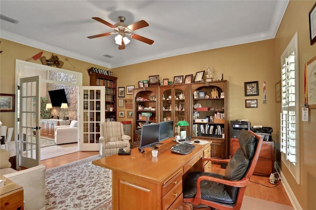 8608 Poinsettia Dr, Temple Terrace, FL 33637 - home office with french doors, light hardwood / wood-style flooring, ceiling fan, crown molding, and a healthy amount of sunlight