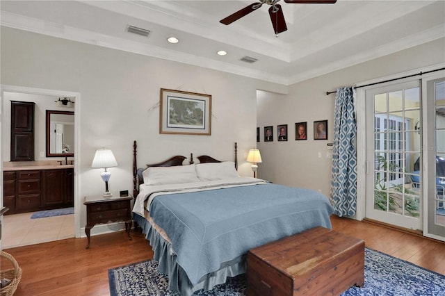 8608 Poinsettia Dr, Temple Terrace, FL 33637 - tiled bedroom featuring ceiling fan, a tray ceiling, access to outside, and ornamental molding