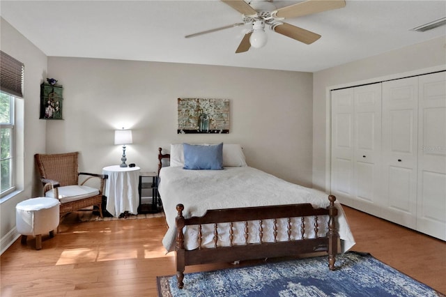 8608 Poinsettia Dr, Temple Terrace, FL 33637 - bedroom featuring a closet, ceiling fan, and hardwood / wood-style flooring