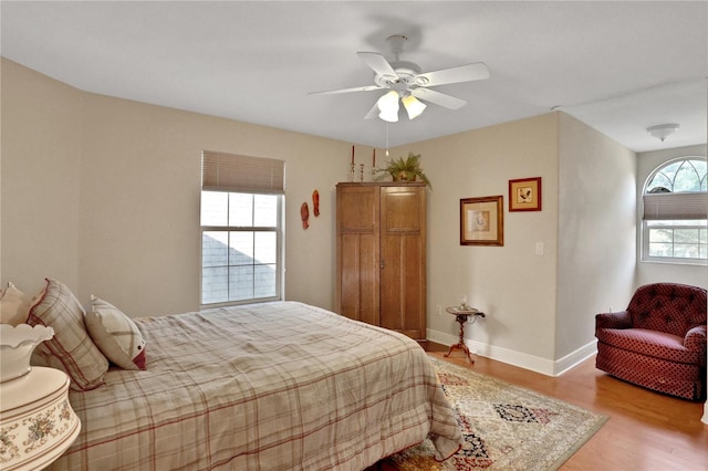 8608 Poinsettia Dr, Temple Terrace, FL 33637 - bedroom featuring wood-type flooring and ceiling fan