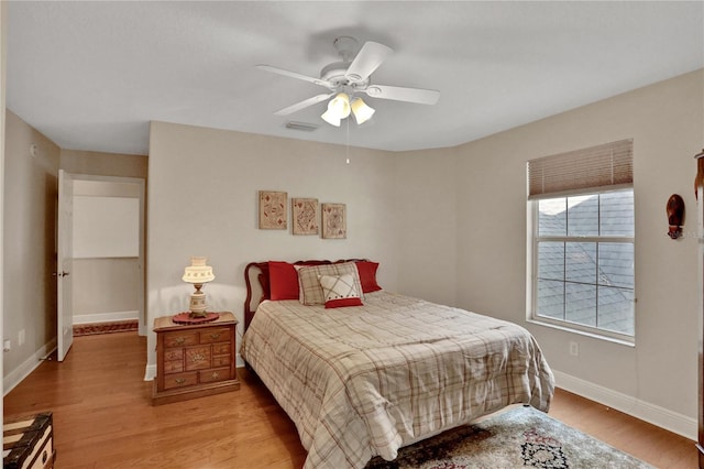 8608 Poinsettia Dr, Temple Terrace, FL 33637 - bedroom with ceiling fan and hardwood / wood-style flooring