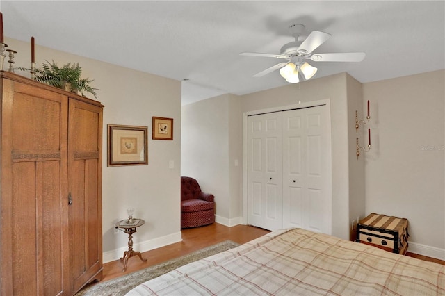 8608 Poinsettia Dr, Temple Terrace, FL 33637 - bedroom featuring wood-type flooring, ceiling fan, and a closet