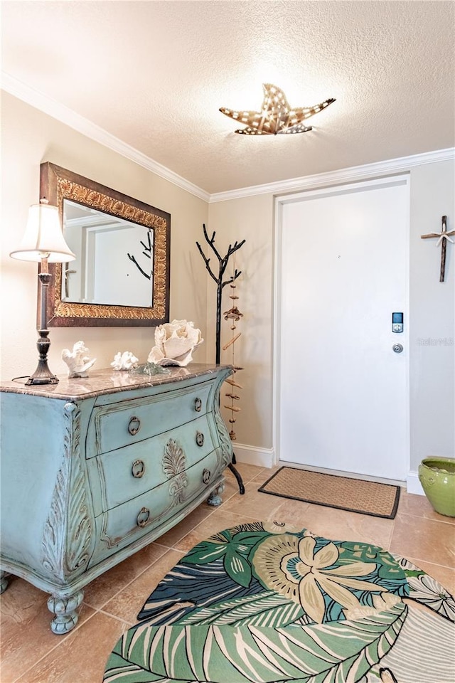 foyer with crown molding, light tile patterned floors, and a textured ceiling