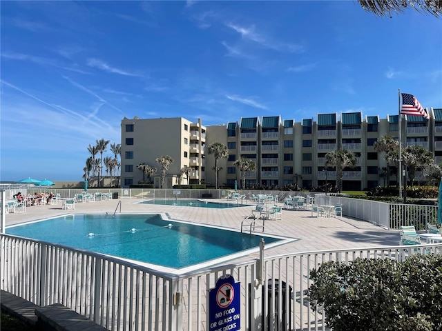 view of swimming pool with a patio