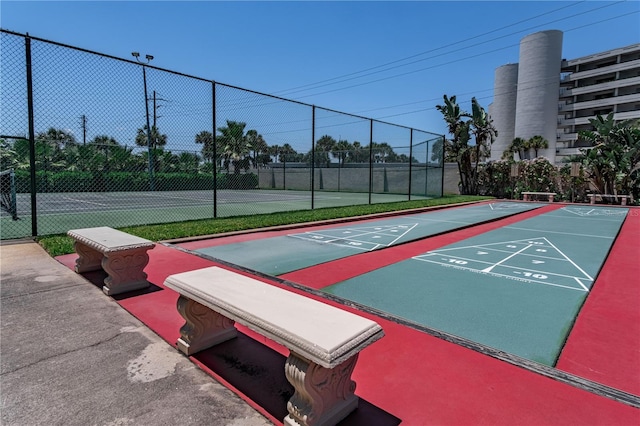 surrounding community with tennis court