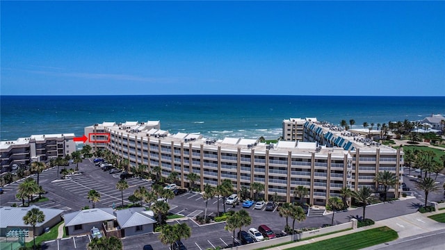 birds eye view of property with a water view