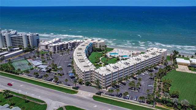 bird's eye view with a water view and a view of the beach