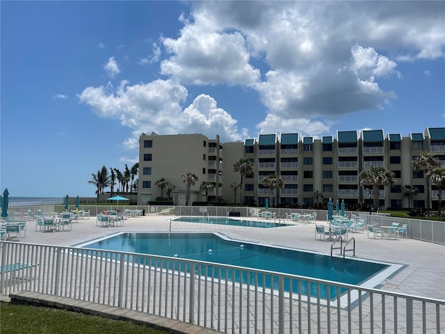 view of swimming pool with a patio area