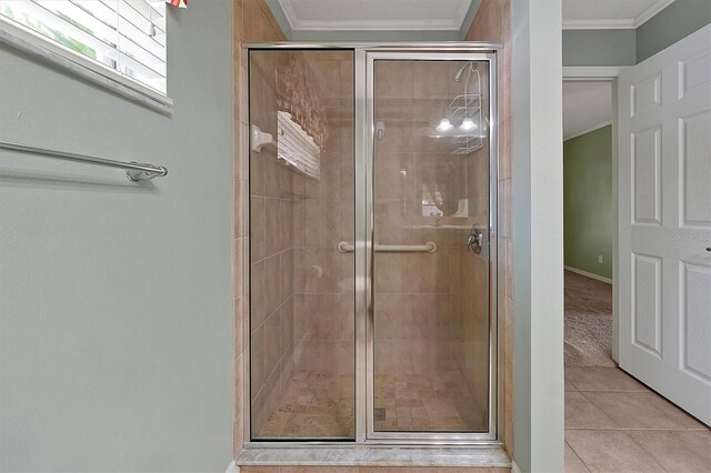 bathroom featuring crown molding, walk in shower, and tile floors