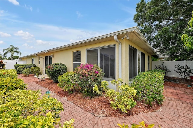 view of side of home featuring a patio area