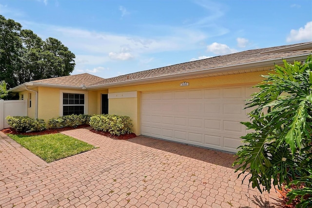 ranch-style home featuring a garage